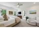 Bright primary bedroom with a luxurious chaise lounge and ensuite bathroom, offering a relaxing retreat at 476 Springer Nw Bnd, Marietta, GA 30060