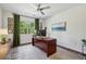 Bright home office with a large desk, window with green curtains, and natural light at 476 Springer Nw Bnd, Marietta, GA 30060