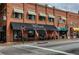Charming street view showcasing local businesses and American flags at 476 Springer Nw Bnd, Marietta, GA 30060