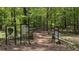 Beautiful wooded walking trail featuring signage and a rustic split-rail fence in a natural setting at 476 Springer Nw Bnd, Marietta, GA 30060