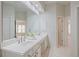 Bright bathroom featuring double sinks, and a large mirror at 478 Vinings Estates Se Dr # B02, Smyrna, GA 30126
