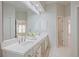 Bathroom featuring a double vanity, large mirror, and bright lighting, creating a clean, modern space at 478 Vinings Estates Se Dr # B02, Smyrna, GA 30126