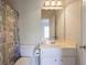 Traditional bathroom with a vanity, toilet, and shower with decorative curtain at 478 Vinings Estates Se Dr # B02, Smyrna, GA 30126