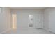 Spacious bedroom with neutral walls, carpet, and multiple doorways at 478 Vinings Estates Se Dr # B02, Smyrna, GA 30126