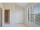 A bedroom with carpet, a double door closet, and a window with blinds at 478 Vinings Estates Se Dr # B02, Smyrna, GA 30126
