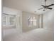 Bright bedroom featuring neutral carpet, a ceiling fan and plenty of natural light through the many windows at 478 Vinings Estates Se Dr # B02, Smyrna, GA 30126