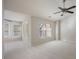 Spacious bedroom featuring neutral carpeting, fan, and an abundance of natural light streaming through multiple windows at 478 Vinings Estates Se Dr # B02, Smyrna, GA 30126