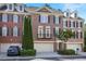 A stately red brick townhouse with black shutters and multiple dormer windows at 478 Vinings Estates Se Dr # B02, Smyrna, GA 30126
