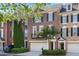 Beautiful brick townhome with black shutters, a two-car garage, and mature landscaping at 478 Vinings Estates Se Dr # B02, Smyrna, GA 30126