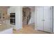 Eat-in kitchen and staircase showcasing hardwood floors, granite countertops, and stainless steel appliances at 478 Vinings Estates Se Dr # B02, Smyrna, GA 30126