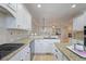 Modern kitchen with granite countertops, white cabinets, stainless steel appliances, and open floor plan at 478 Vinings Estates Se Dr # B02, Smyrna, GA 30126