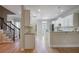 Bright and airy kitchen with white cabinets, granite countertops, and stainless-steel appliances at 478 Vinings Estates Se Dr # B02, Smyrna, GA 30126