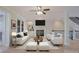 Bright living room with fireplace, ceiling fan, and hardwood floors offers space and comfort at 478 Vinings Estates Se Dr # B02, Smyrna, GA 30126