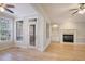 Light hardwood floors, fireplace, and an exit door make this living room stand out at 478 Vinings Estates Se Dr # B02, Smyrna, GA 30126