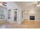 Bright living room with hardwood floors, fireplace, built-in shelves, and a glass door at 478 Vinings Estates Se Dr # B02, Smyrna, GA 30126