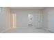 A neutral living room with carpet and three different doorways and a closet at 478 Vinings Estates Se Dr # B02, Smyrna, GA 30126
