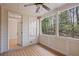 Screened porch with wood floors and ceiling fan overlooks the backyard at 478 Vinings Estates Se Dr # B02, Smyrna, GA 30126