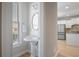 Powder room is located next to kitchen and has wood floors at 478 Vinings Estates Se Dr # B02, Smyrna, GA 30126