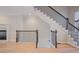 Elegant staircase with dark metal railings, hardwood floors, and classic white trim at 478 Vinings Estates Se Dr # B02, Smyrna, GA 30126