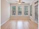 Sun-filled room with hardwood floors, multiple windows, and natural light at 478 Vinings Estates Se Dr # B02, Smyrna, GA 30126