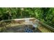 Open back deck featuring white chairs and outdoor rug at 728 Brittany Ct, Stone Mountain, GA 30083