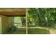 View of the backyard patio with trees in the background at 728 Brittany Ct, Stone Mountain, GA 30083