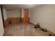Finished basement area with paneled walls, carpet, and closet at 728 Brittany Ct, Stone Mountain, GA 30083