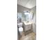 Bathroom featuring a toilet, vanity with mirror and cabinet, and neutral flooring at 728 Brittany Ct, Stone Mountain, GA 30083