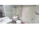 This bathroom has tile floors, vanity, shower and tub at 728 Brittany Ct, Stone Mountain, GA 30083
