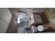 Bathroom with toilet, sink, cabinets, mirror, and shower access at 728 Brittany Ct, Stone Mountain, GA 30083