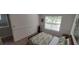 Bedroom featuring a window and neutral walls and carpeting at 728 Brittany Ct, Stone Mountain, GA 30083