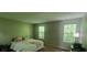 Bedroom with a neutral color scheme, two windows, and a queen-sized bed at 728 Brittany Ct, Stone Mountain, GA 30083