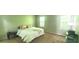 Spacious bedroom with two windows and a queen-sized bed at 728 Brittany Ct, Stone Mountain, GA 30083