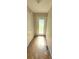 Bright entryway featuring hardwood floors and a glass-paneled front door, creating a welcoming entrance at 728 Brittany Ct, Stone Mountain, GA 30083