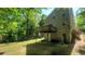 Exterior view of the home with a green yard and back deck at 728 Brittany Ct, Stone Mountain, GA 30083