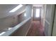 Hallway with a skylight, carpeted floor, and neutral paint at 728 Brittany Ct, Stone Mountain, GA 30083