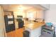 Functional kitchen featuring white cabinets, wood countertops, and modern appliances, ideal for cooking and entertaining at 728 Brittany Ct, Stone Mountain, GA 30083