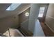 Staircase with a skylight and octagon window providing natural light at 728 Brittany Ct, Stone Mountain, GA 30083