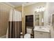Bathroom has a shower, toilet, and sink with storage and a large mirror at 2277 Peachtree Ne Rd # 701, Atlanta, GA 30309