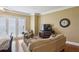 Cozy bedroom with a ceiling fan and a comfortable seating area near large windows at 2277 Peachtree Ne Rd # 701, Atlanta, GA 30309