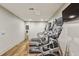 Clean, compact exercise room with treadmills, ellipticals, and mounted TV's is designed for cardio workouts at 2277 Peachtree Ne Rd # 701, Atlanta, GA 30309