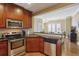 Well-equipped kitchen with stainless steel appliances and granite countertops offers modern convenience at 2277 Peachtree Ne Rd # 701, Atlanta, GA 30309