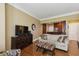 Bright living room with hardwood floors and an adjacent kitchen area at 2277 Peachtree Ne Rd # 701, Atlanta, GA 30309