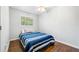 Bedroom showcasing hardwood floors, a ceiling fan, and a window for natural light at 3180 Spring St, South Fulton, GA 30349