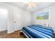 Bedroom highlighting wood floors, a ceiling fan, and a window bringing in natural light at 3180 Spring St, South Fulton, GA 30349