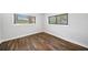 Bedroom with hardwood floors and windows providing natural light and pleasant views at 3180 Spring St, South Fulton, GA 30349