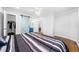 Bedroom featuring a barn door, hardwood floors, and an open closet space at 3180 Spring St, South Fulton, GA 30349