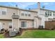 Backyard featuring sliding glass door, small patio, lawn and siding exterior at 1310 Kilmington Ct, Alpharetta, GA 30009