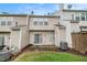 Siding exterior, backyard featuring sliding glass door, small patio, and lawn at 1310 Kilmington Ct, Alpharetta, GA 30009