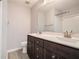 Bathroom featuring a double sink vanity with modern fixtures and a shower with subway tile at 1310 Kilmington Ct, Alpharetta, GA 30009